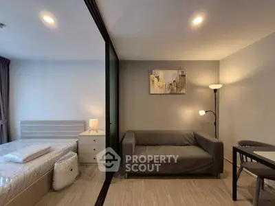 Modern studio apartment with cozy living area and stylish decor