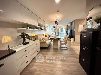 Stylish modern living room with elegant decor and open layout, featuring sleek furniture and ambient lighting.