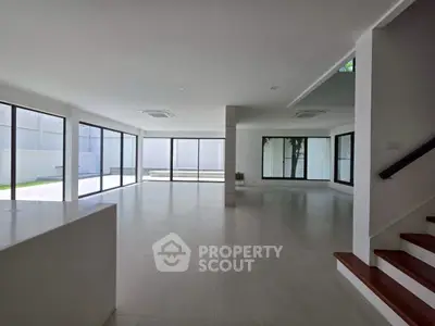 Spacious modern living room with large windows and open layout