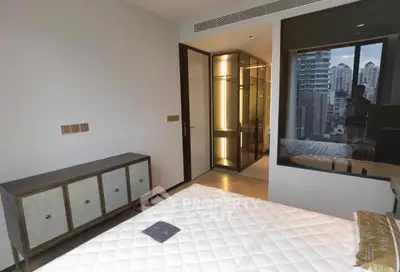 Modern bedroom with city view and stylish furniture