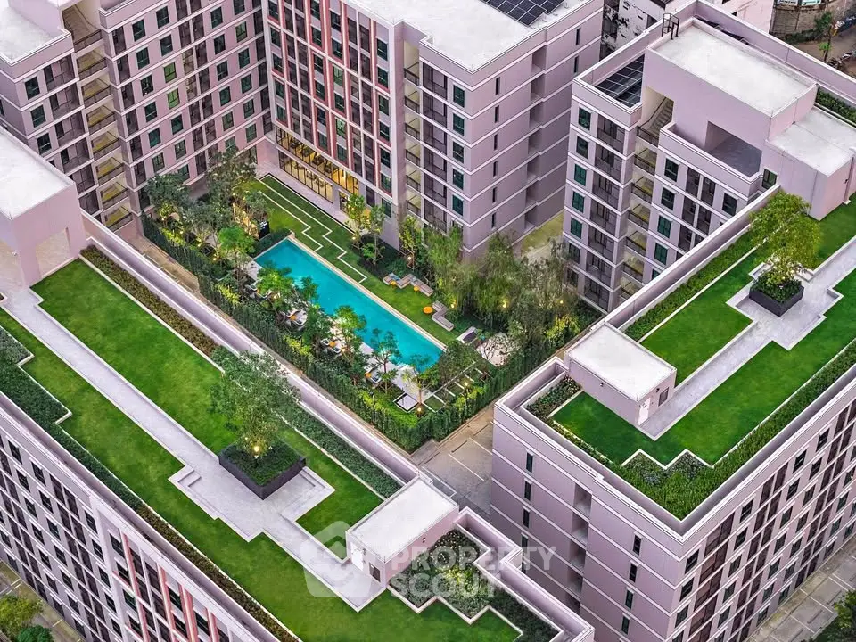 Luxurious modern apartment complex with rooftop gardens and central pool area.