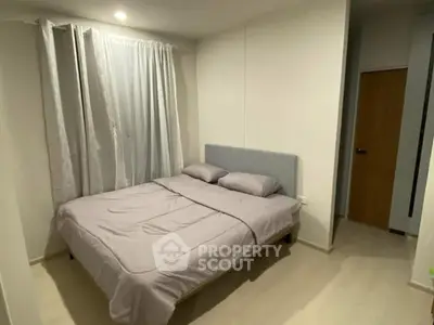 Cozy bedroom with modern decor and soft lighting, perfect for relaxation and comfort.
