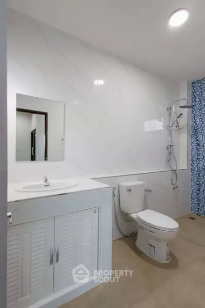 Modern bathroom with sleek fixtures and stylish tile accents