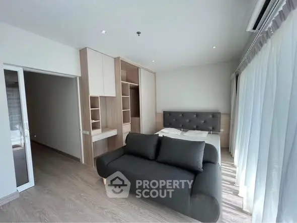 Modern bedroom with sleek design and ample natural light