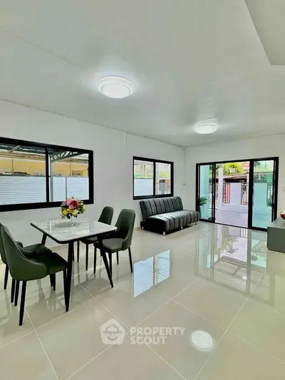 Spacious modern living room with sleek furniture and large windows