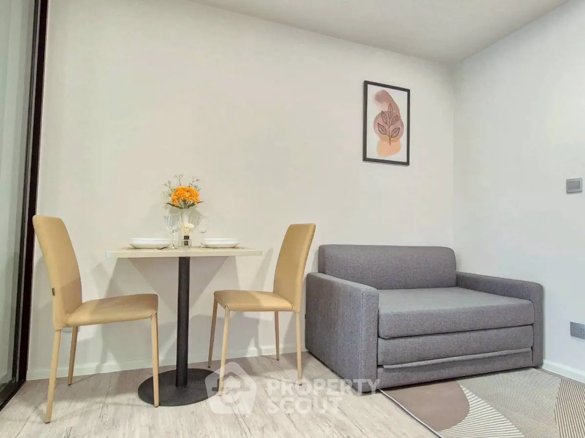 Modern living room with cozy sofa and dining area in stylish apartment.