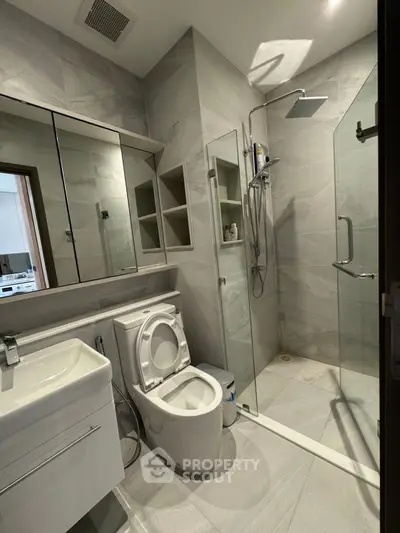 Modern bathroom with sleek shower and elegant fixtures