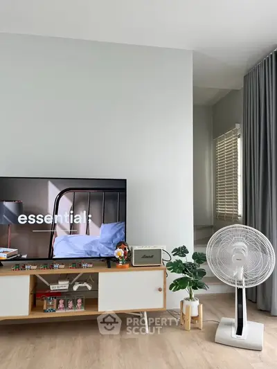 Modern living room with stylish decor and entertainment setup