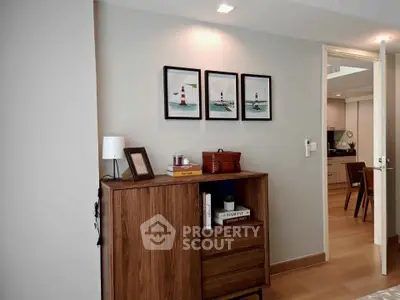 Stylish interior with wooden cabinet and modern decor in a cozy living space.