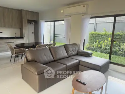 Modern living room with sleek furniture and garden view