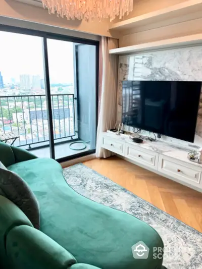 Luxurious living room with chic green sofa and stunning city view from balcony