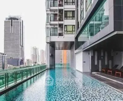 Luxurious high-rise building with stunning rooftop pool and city views.