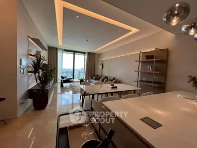 Luxurious modern living room with open layout and stunning city view, featuring elegant decor and ample natural light.
