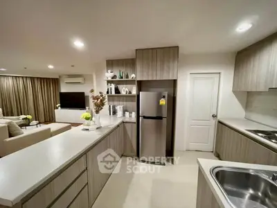 Modern kitchen with open layout and sleek appliances in a stylish apartment