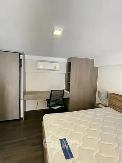 Modern bedroom with sleek furniture and comfortable mattress