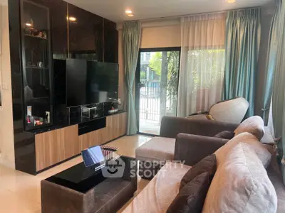 Modern living room with sleek entertainment center and cozy seating