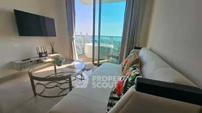 Modern living room with balcony and city view, featuring stylish furniture and decor.