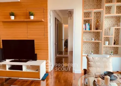 Chic living room with modern decor and wooden accents, perfect for stylish urban living.