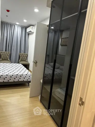 Modern bedroom with stylish decor and ample storage space