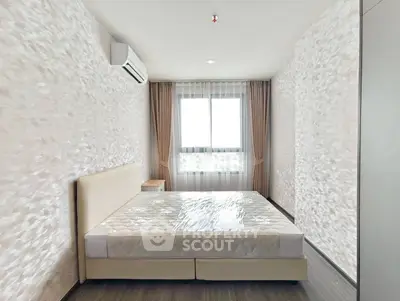 Modern bedroom with stylish decor and natural light