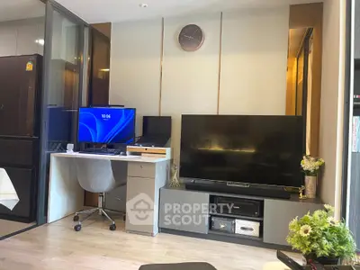 Modern living room with TV and workspace in stylish apartment