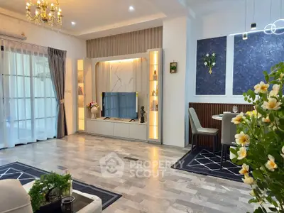 Elegant living room with modern decor, chandelier, and dining area, featuring stylish flooring and natural light.