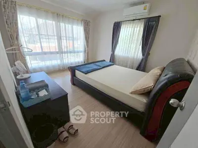 Cozy bedroom with natural light and modern furnishings