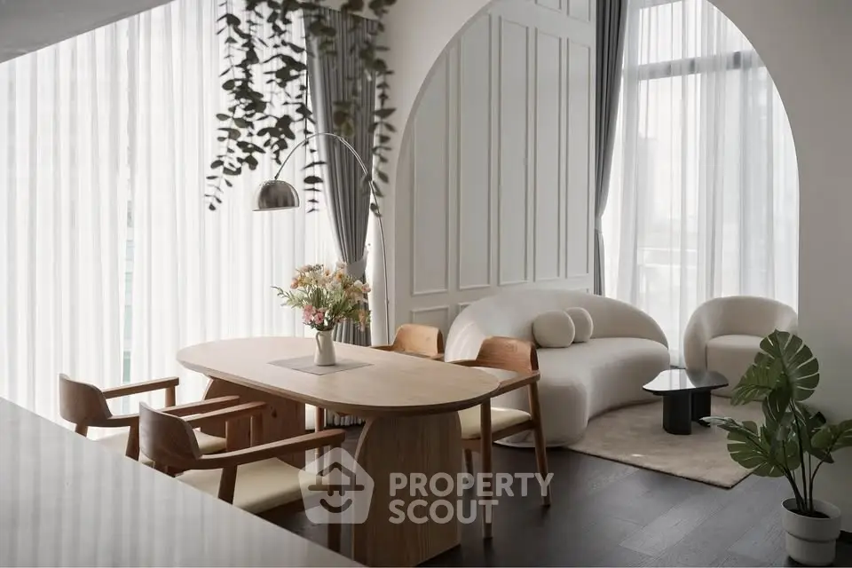 Elegant modern living room with stylish furniture and large windows, perfect for urban living.