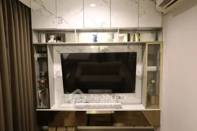 Modern living room with sleek marble TV wall unit and stylish decor.