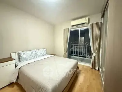 Cozy bedroom with balcony view and modern air conditioning