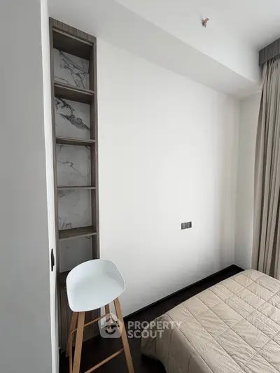Modern minimalist bedroom with sleek design and neutral tones