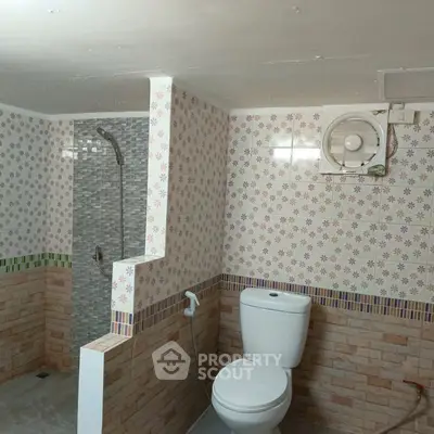 Cozy bathroom with tiled walls and modern fixtures