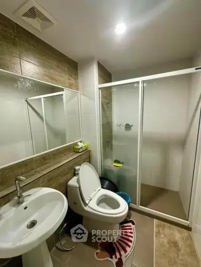 Modern bathroom with shower enclosure and stylish tile design