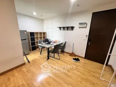 Modern apartment interior with dining area and wooden flooring