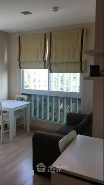 Cozy living room with natural light and modern furnishings