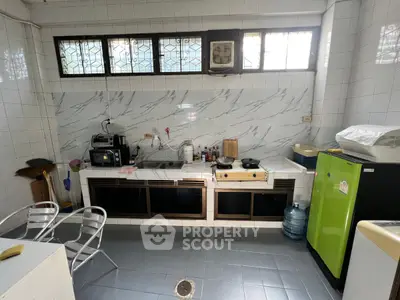 Spacious kitchen with modern appliances and ample storage space