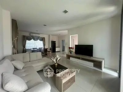 Spacious living room with modern furniture and natural light