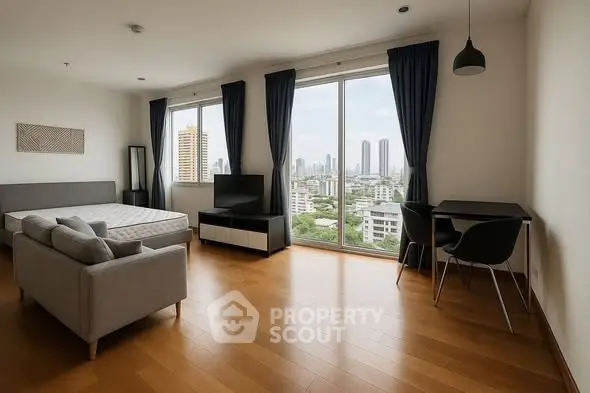 Spacious bedroom with city view, modern furniture, and large windows.