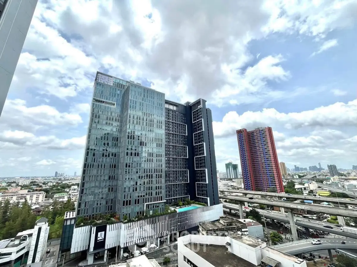 Stunning cityscape view featuring modern high-rise buildings under a vibrant sky, ideal for urban living.