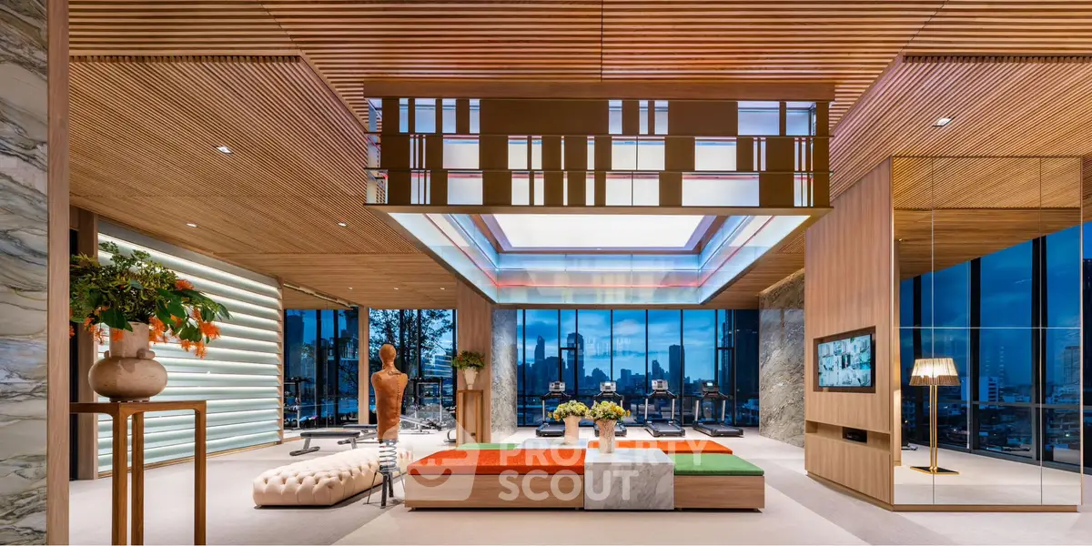 Luxurious modern living room with city skyline view, stylish decor, and ambient lighting.