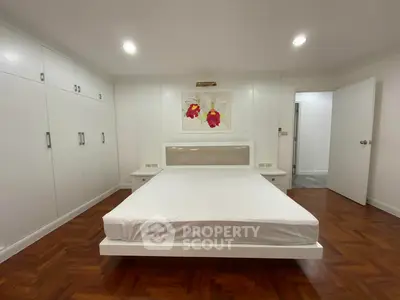 Spacious bedroom with modern design and ample storage space