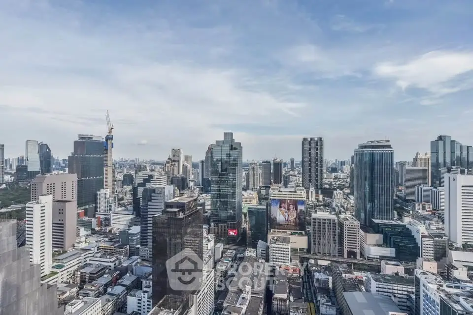 Stunning cityscape view showcasing modern skyscrapers and urban skyline under a clear blue sky.
