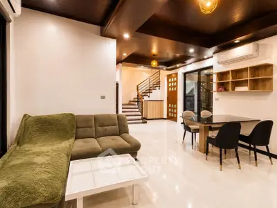 Spacious modern living room with elegant dining area and stylish decor