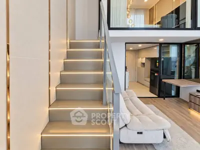Modern duplex apartment with stylish staircase and open living area