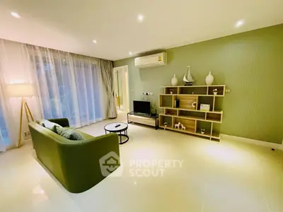 Spacious modern living room with elegant decor and large windows.