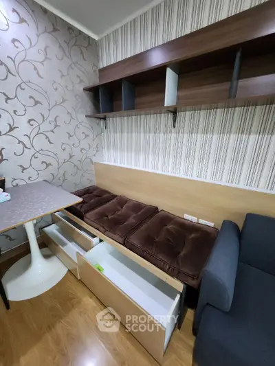 Cozy living room with stylish wallpaper and built-in seating storage