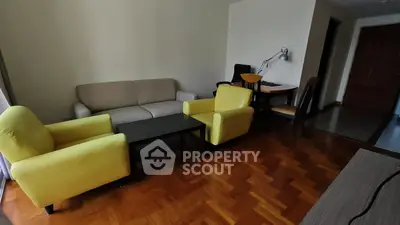 Spacious living room with modern furniture and parquet flooring