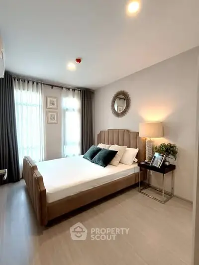 Elegant bedroom with stylish decor and natural light