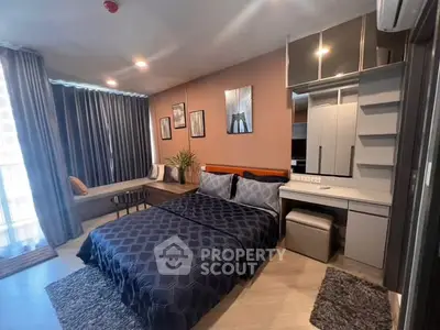 Modern bedroom with stylish decor and natural light in a contemporary apartment.