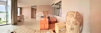 Spacious unfurnished living room with large windows and natural light